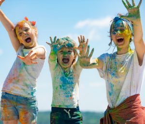 happy kids covered in paint