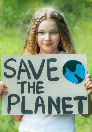 Teen holding save the planet poster